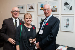 Library board member Geoff Dowd, Kathryn McKnight and Michael Harrison. Aislin cartoons donated by Terry Mosher.